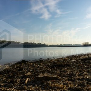 smooth water from the Rhine on a stone beach