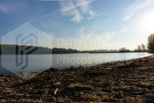 smooth water from the Rhine on a stone beach